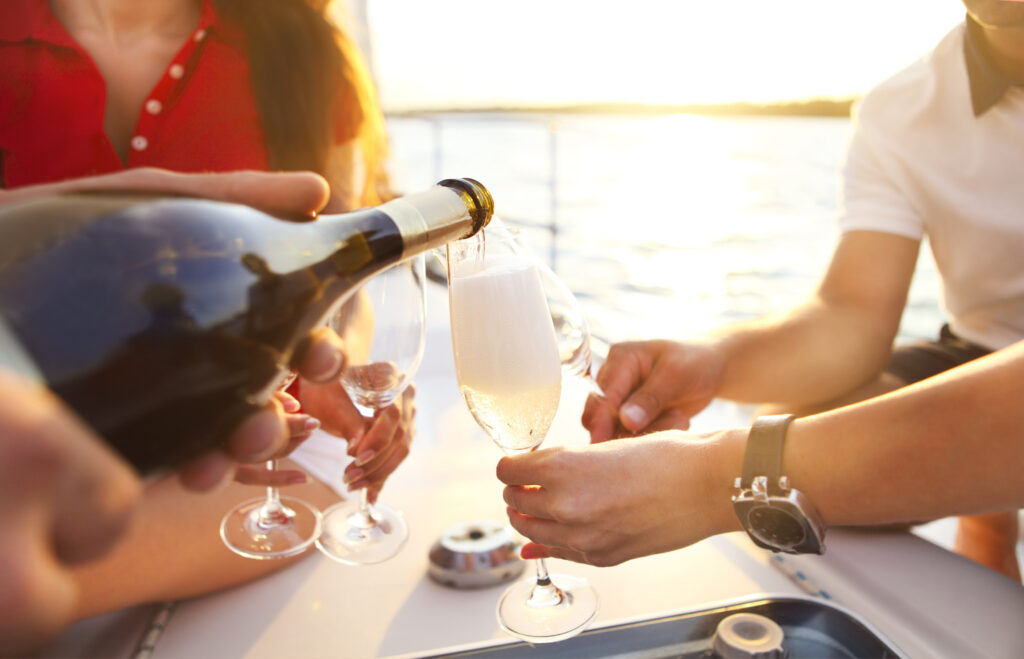 champagne being poured on a boat