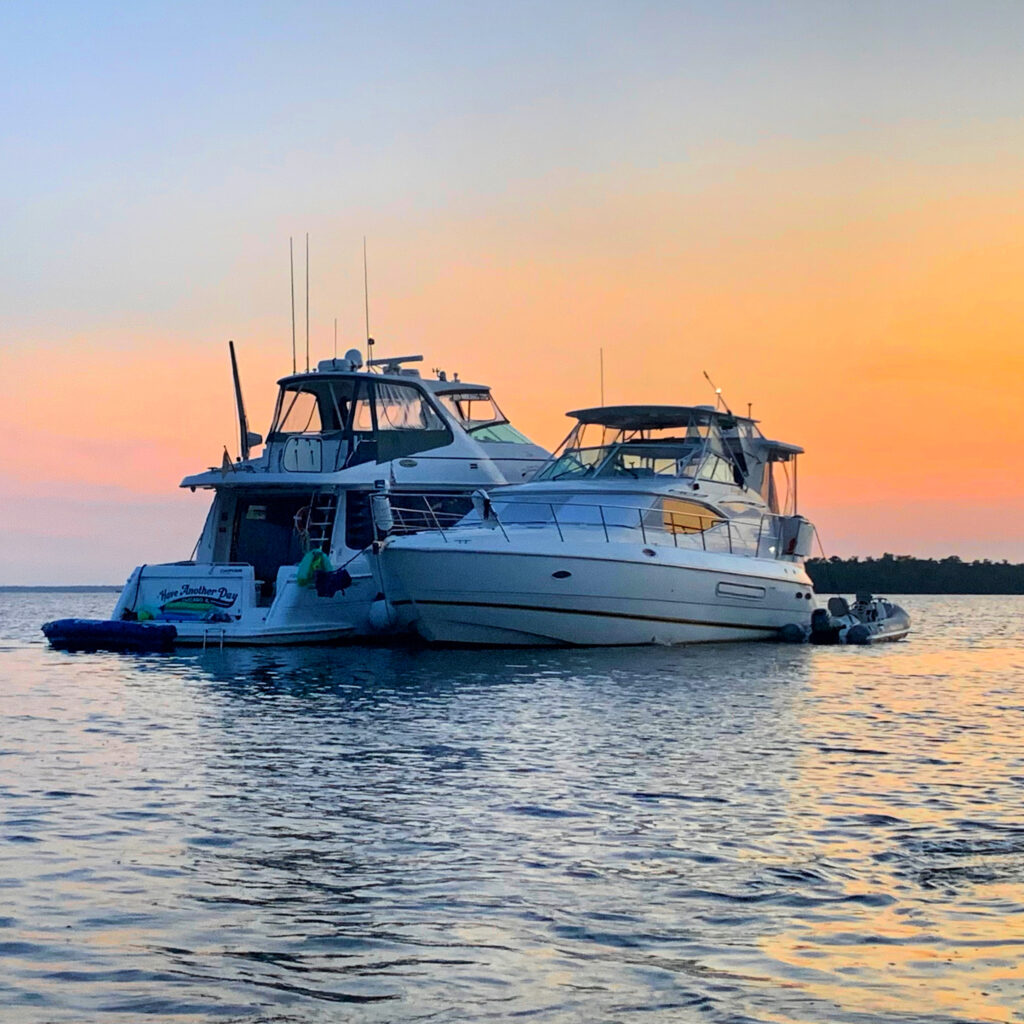 two boats at sunset