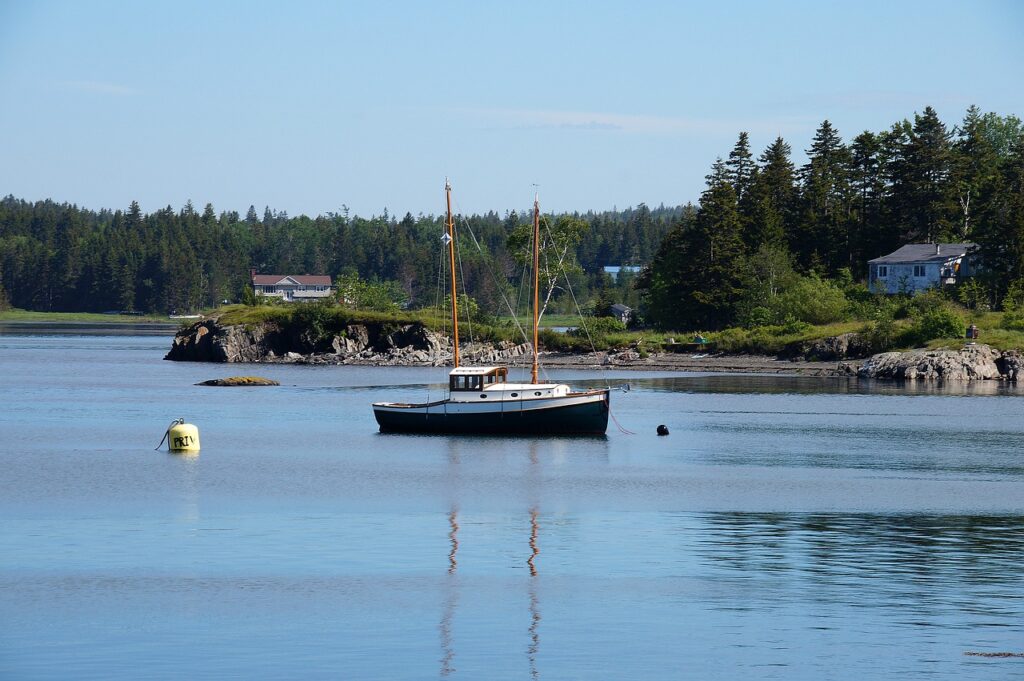 a boat is moored off new brunswick, canada in the st. lawrence river seaway