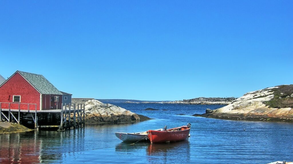 canoes are anchored in the st. lawrence seaway in nova scotia, canada