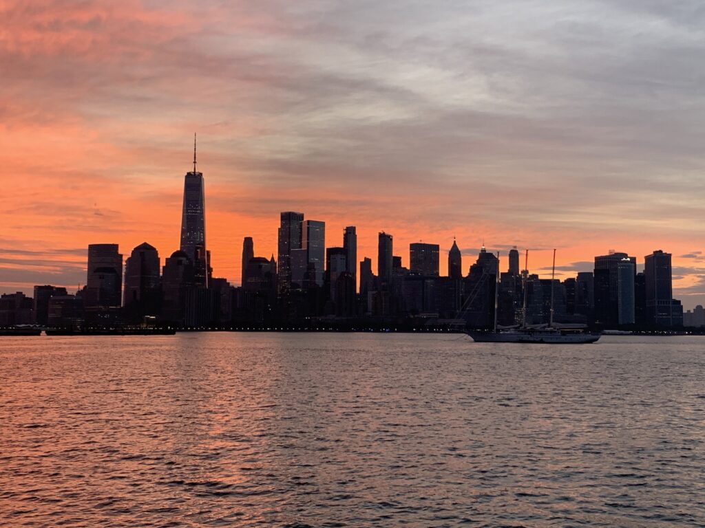 the skyline of new york city at sunset